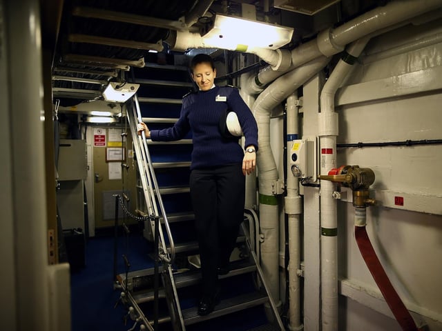 A crew member seen walking down a stairwell on HMS Illustrious May 10, 2013 Photo by Dan Kitwood/Getty Images