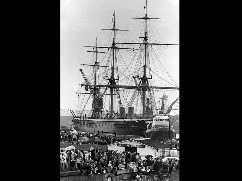 HMS Warrior's masts attract a crowd in Portsmouth (undated). The News PP4330