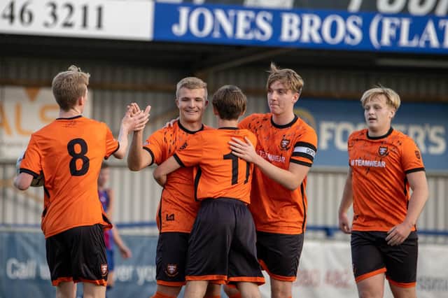 AFC Portchester celebrate Blakeley Fairweather's equaliser against US Portsmouth. Picture by Alex Shute.