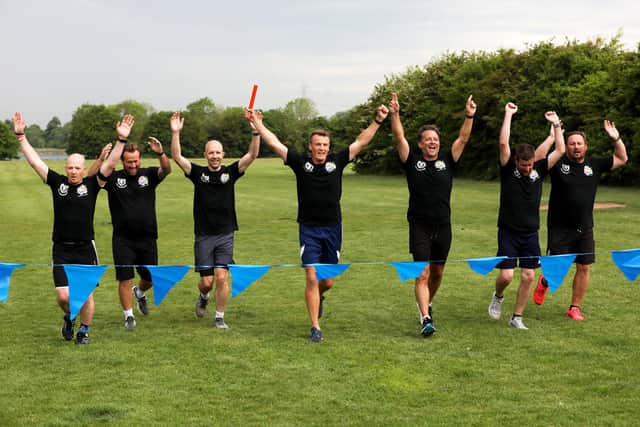 Members of the AFC Portchester vets football team finish their 24-hour relay run (from left) Keith McIntyre, Simon Hore, Phil Jeynes, Peter Sanderson, Keith Ashton, Mike Counsell and Dan Mortimer. Picture: Sam Stephenson.