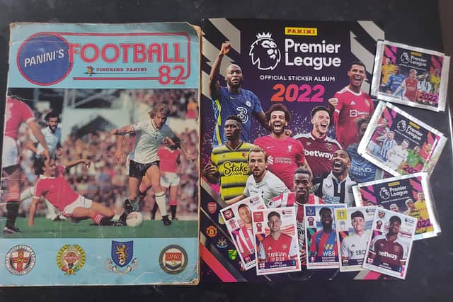 Two albums, 40 years apart - Panini's 'Football 82' book and the 2022 Premier League version with a selection of stickers.