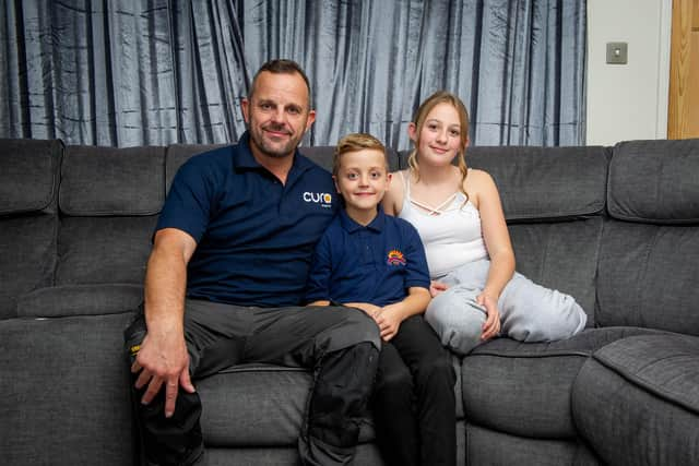 Proud dead John Hoskin at his home with his son, Harvey, eight, and daughter, Daisy, 11.
Picture: Habibur Rahman