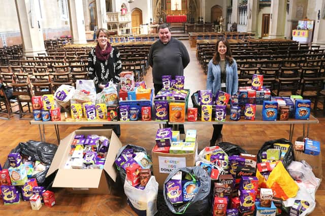 Easter eggs at St Mary's Church, Fratton in 2019. Vicar Bob White is pictured with (left) Donna Burney from the Roberts Centre and Charlotte Ferguson, from Stop Domestic Abuse
