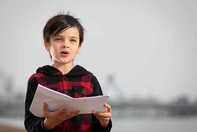 Thomas Roughan, 8, reads his poem called Ruby Red about racism which has been featured on the Black Lives Matter website. Pictured on Southsea beach. 
Picture: Chris Moorhouse   (081120-31)