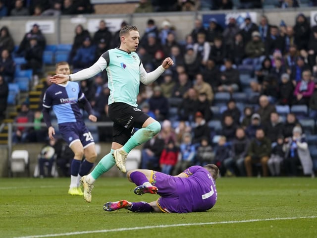 Max Stryjek beats Ronan Curtis to the ball in the first half of Pompey's trip to Wycombe. Picture: Jason Brown/ProSportsImages