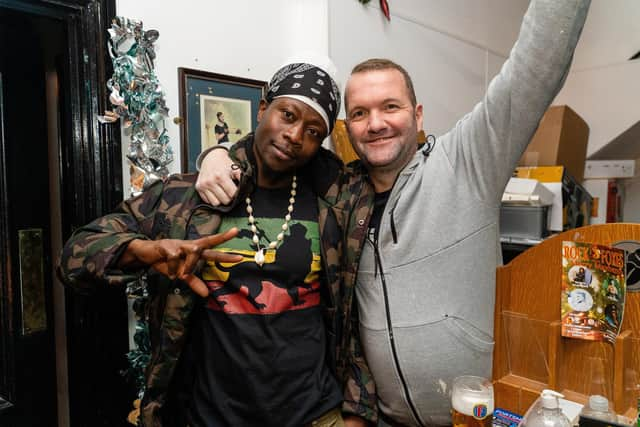 Domonic Corree and his friend Shawn while watching England vs France The Kings in Southsea, on Saturday, December 10. Picture: Matthew Clark.