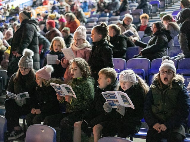 Meon Junior School singing at the event