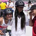 Twelve-year-old silver medalist Kokona Hiraki, of Japan, centre, and gold medalist Sakura Yosozumi of Japan and bronze medalist Sky Brown of Britain, left, celebrate after the women's park skateboarding finals. Picture: AP Photo/Ben Curtis.