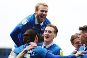 Pompey's players celebrate what would prove to be the matchwinner from Marcus Harness against Ipswich on Saturday. Picture: Joe Pepler