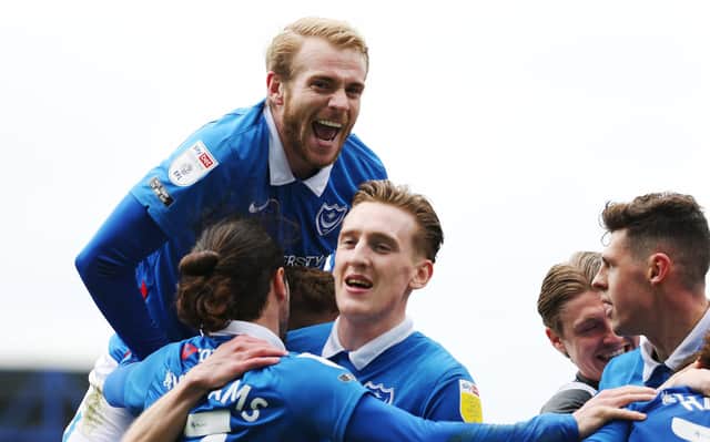 Pompey's players celebrate what would prove to be the matchwinner from Marcus Harness against Ipswich on Saturday. Picture: Joe Pepler