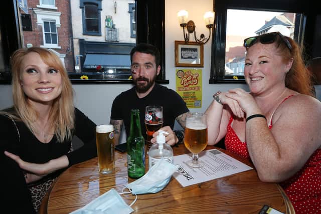 From left, Anna Weller, SJ James and Alice Monard. Fans watch England v Ukraine in the quarter finals of Euro 2020, in The Kings pub, Albert Rd, Southsea
Picture: Chris Moorhouse (jpns 030721-18)