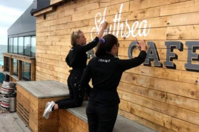 2 Sisters painting Southsea Beach Cafe.