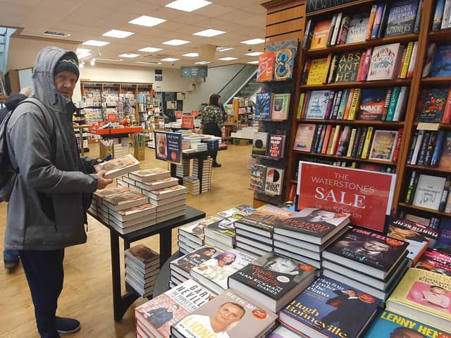Peter, 69, grabbing a copy of Prince Harry's new book Spare, but not for himself. Picture: Habibur Rahman.