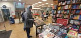 Peter, 69, grabbing a copy of Prince Harry's new book Spare, but not for himself. Picture: Habibur Rahman.