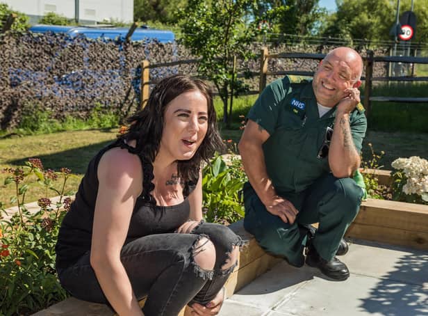 A light-hearted moment as Kirsty Hext (26) chats with Paramedic Tim Ray (51). Picture: Mike Cooter (090621)