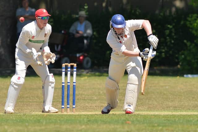 Havant batting against South Wilts, whose captain and wicket-keeper Ben Draper watches on. Picture by Martyn White