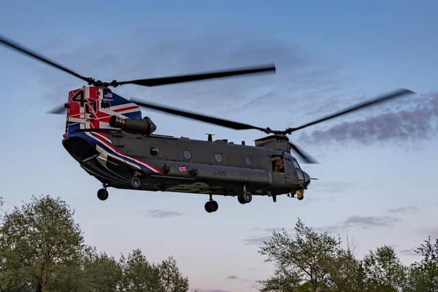 The RAF CH-47 Chinook helicopter from Odiham which landed on HMS Prince of Wales is pictured in action transporting troops from 40 Commando Royal Marines. Photo: Royal Navy