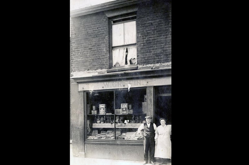 William King from Hayling Island sent in this photograph of his grandparents Mr and Mrs W Griffin, standing outside their small grocer's shop in Buckland.