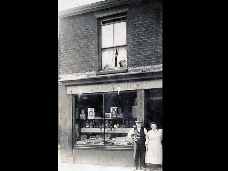 William King from Hayling Island sent in this photograph of his grandparents Mr and Mrs W Griffin, standing outside their small grocer's shop in Buckland.