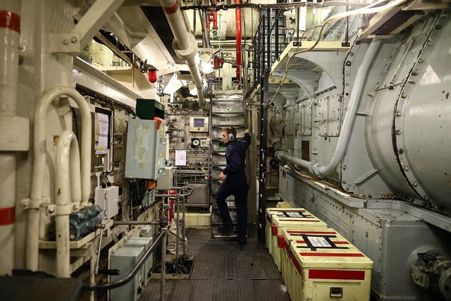 Crew member ETME Turnley seen working in the engine room onboard HMS Illustrious May 10, 2013. Photo by Dan Kitwood/Getty Images