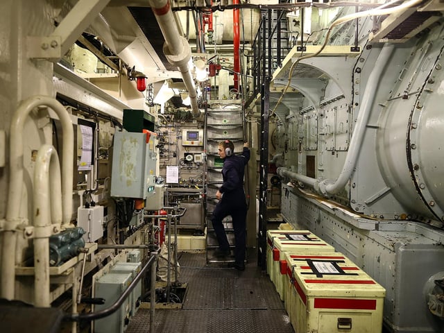 Crew member ETME Turnley seen working in the engine room onboard HMS Illustrious May 10, 2013. Photo by Dan Kitwood/Getty Images