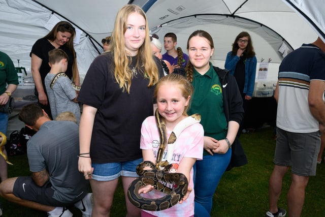 Pictured is: Natasha and Charlie with Amelia Day who holds Julia and Romeo the Pythons from the Portsmouth Reptile and Amphibian SocietyPicture: Keith Woodland (230621-63)