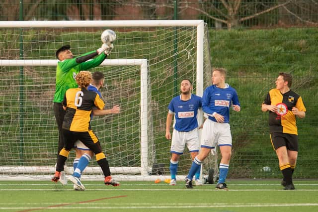 Prad Bains punches clear during Denmead's Hampshire Premier League game with Michelmersh & Timsbury in 2019/20.  Picture: Keith Woodland