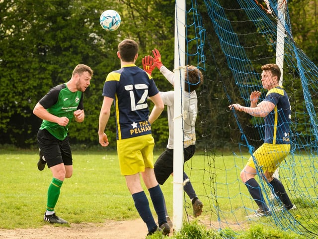 Action from Saturn Royale's 1-0 win over Pelham Arms (blue and yellow kit) in the second Adelaide Cup semi-final. Picture: Keith Woodland (300421-863)