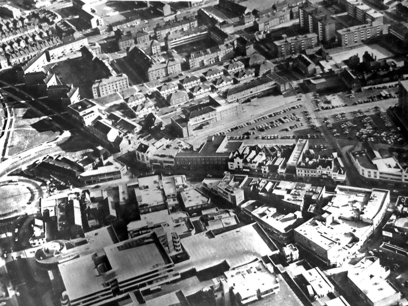Landscape - This aerial picture is an opportunity to see a selection of the various styles of architecture to be found in the heart of Portsmouth in 1970. In the foreground is the Tricorn and behind it the diverse styling of the shops and stores in Commercial Road. The gabled roofs of the Victorian houses left, can be contrasted with the sloping roofs of the blocks of flats, centre
