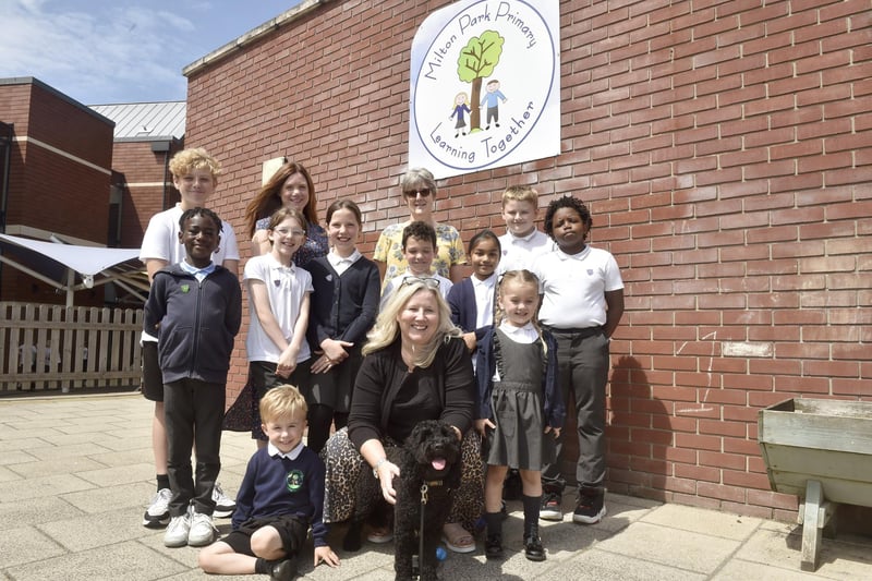 Milton Park Primary School in Portsmouth, has received a good Ofsted report with some outstanding elements. The report was published on July 18, 2024. Pictured is: (back middle l-r) Ros Middleton, deputy headteacher and Anna Young, assistant headteacher with (front middle) Wendy Fowler, headteacher, Mabel the school well-being dog and some of the children.Picture: Sarah Standing (180724-7332)