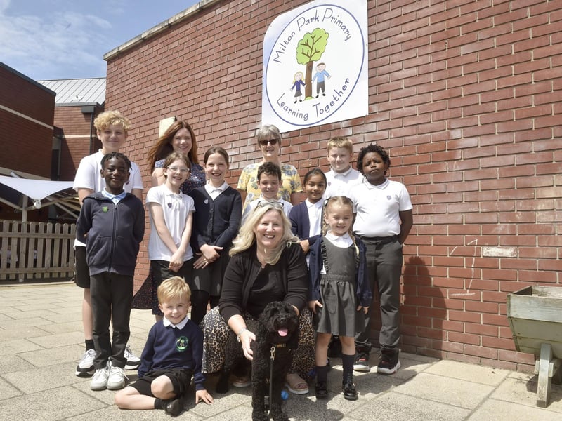 Milton Park Primary School in Portsmouth, has received a good Ofsted report with some outstanding elements. The report was published on July 18, 2024. Pictured is: (back middle l-r) Ros Middleton, deputy headteacher and Anna Young, assistant headteacher with (front middle) Wendy Fowler, headteacher, Mabel the school well-being dog and some of the children.Picture: Sarah Standing (180724-7332)