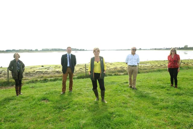 Environment Minister Rebecca Pow MP visited Warblington Farm in Havant which is set to become a nature reserve to reduce nitrogen pollution.Pictured is: (l-r) SJ Hunt, Solent LEP director, Cllr Gary Hughes, deputy leader of Havant Borough Council and cabinet lead for planning, Hayling seafront strategy and commercial services, Environment Minister Rebecca Pow, Tony Juniper, chairman of Natural England and Anna Parry, partnership manager for Bird Aware Solent. Picture: Sarah Standing (100920-3713)