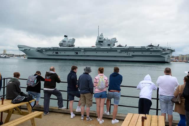 Aircraft carrier HMS Prince of Wales departs from the dock on June 6, 2021 in Portsmouth. The warship's departure was postponed from its originally scheduled disembarkation yesterday afternoon. (Photo by Finnbarr Webster/Getty Images)