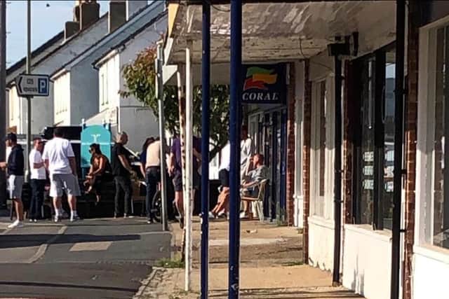 People queuing outside Ralph's wine bar in Elm Grove Hayling Island on Friday afternoon, for a charity beer giveaway. The owner says social distancing guidelines were not breached.