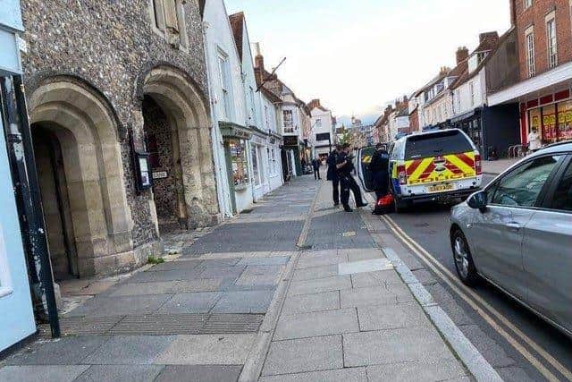 Police seen arresting a man in South Street, Chichester, on Thursday evening