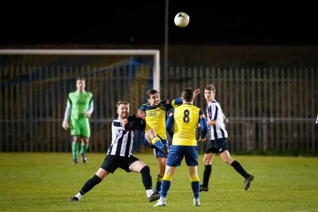 Action from last night's Portsmouth Senior Cup tie where holders Moneyfields defeated two divisions lower Hayling United (black/white) 7-1 at Dover Road. Picture: Dave Bodymore.
