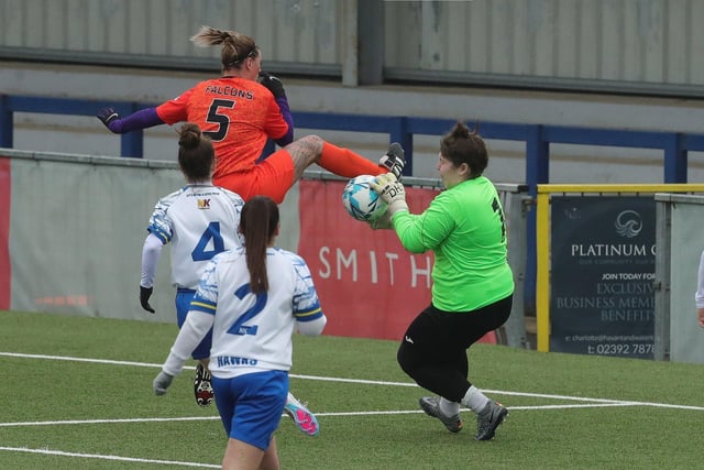 Gosport Falcons' Danielle Clark challenges Hawks goalkeeper Jade Kibell. Picture: Dave Haines
