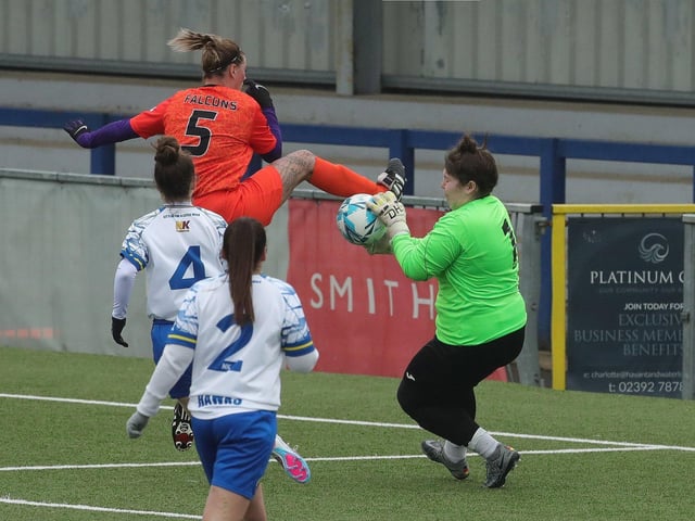 Gosport Falcons' Danielle Clark challenges Hawks goalkeeper Jade Kibell. Picture: Dave Haines