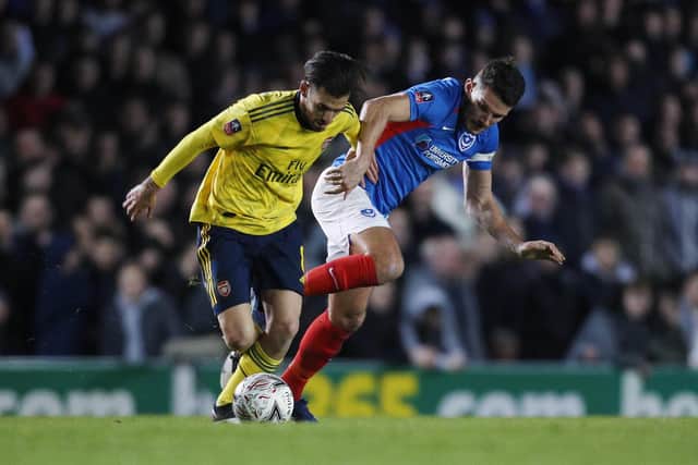 Gareth Evans tussles for possession against Arsenal in last season's FA Cup encounter. Picture: Joe Pepler
