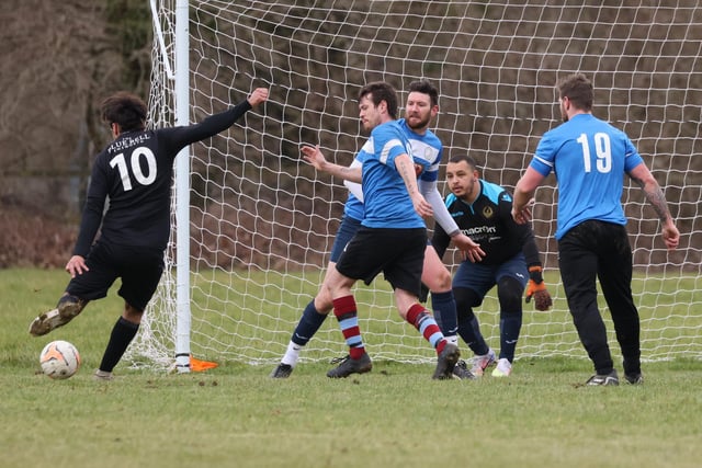 Mauro Morais scores one of his five goals for Emsworth (black/white) v Bransbury. Picture by Kevin Shipp