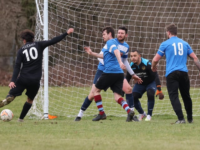 Mauro Morais scores one of his five goals for Emsworth (black/white) v Bransbury. Picture by Kevin Shipp