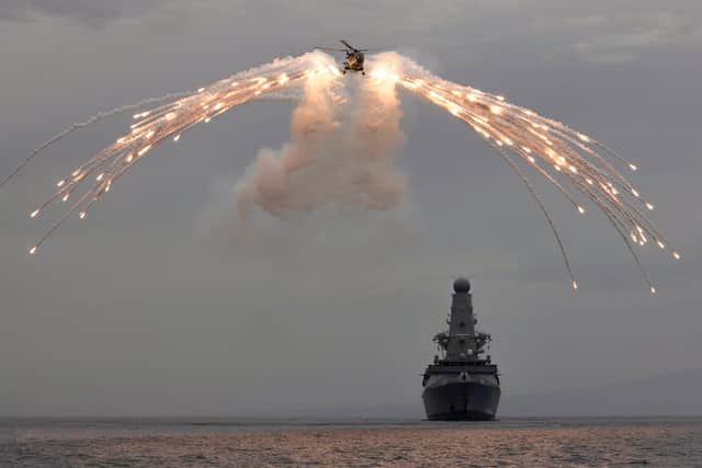 Pictured: 219 Flight take part in a flare firing on board HMS Defender whilst in the Mediterranean. Photo: LPhot Dan Rosenbaum