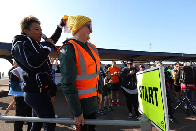 Dame Kelly introduces Kath Newell who was volunteering for the 378th time. Southsea parkrun with Olympic gold medallist Dame Kelly Holmes, who was working on behalf of new parkrun sponsor De'LonghiPicture: Chris Moorhouse (jpns 190322-09)