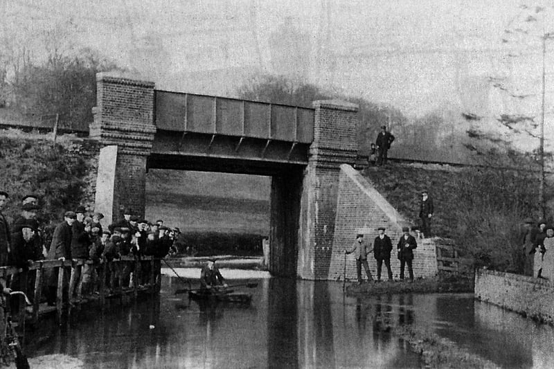 Water under the railway bridge at Dean Lane End, Rowland's Castle circa 1900.
The water was so deep a canoe could be paddled. Picture: Ralph Cousins postcard collection.