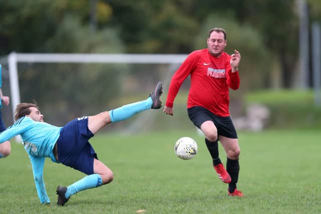 Jamie Peters (Portchester Rovers, left) in action during his side's dramatic win against Wymering. Picture: Chris Moorhouse