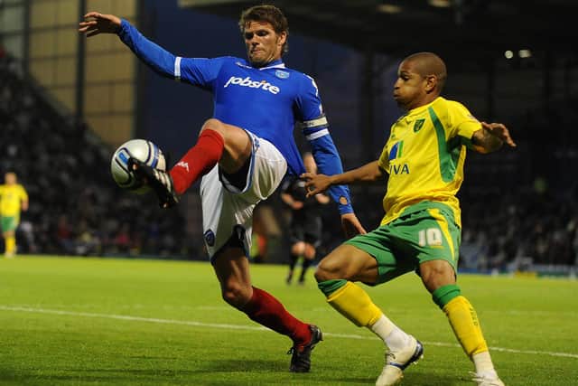Simeon Jackson, right, with Portsmouth's Hermann Hreidarsson at Fratton Park in 2011. Pic: Empics.