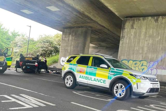 A picture from the scene in Eastern Road today as a clip flipped onto its roof.