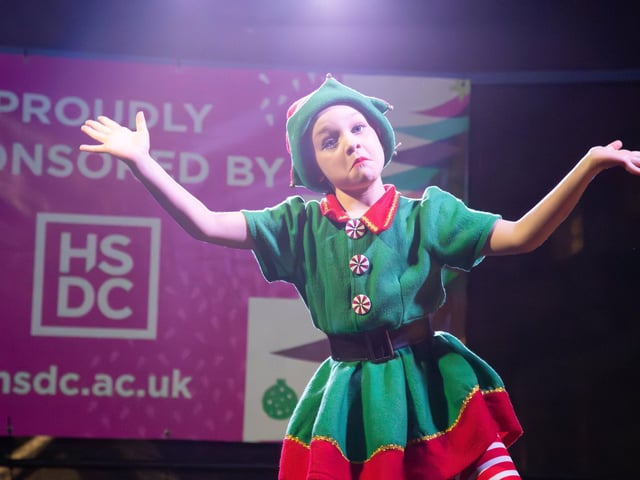Hundreds of residents descended on Commercial Road to watch local dance troops and celebrities come together to turn on the Christmas lights.
Pictured - Young dancers performing on stage
Photos by Alex Shute