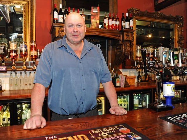 Manager Ken Moore behind the bar in 2013 (131050-9455)