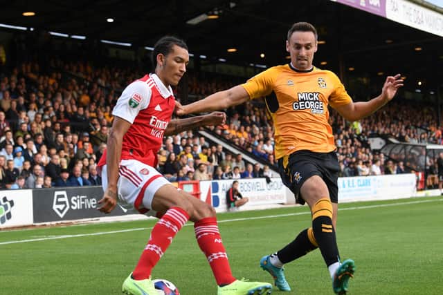 Cambridge United's Brandon Haunstrup in action against Arsenal Under-21s player Kido Taylor-Hart in the Papa Johns Trophy in August 2022. Unfortunately, injury has meant Haunstrup hasn't played since. Picture: David Price/Arsenal FC via Getty Images.